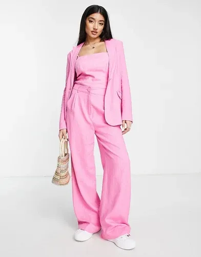 Pantalones de traje rosa luminoso extragrandes de lino de The Frolic (8070748)