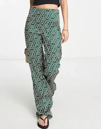 Pantalones verdes con estampado gráfico de cadenas de satén de Mango (8155951)